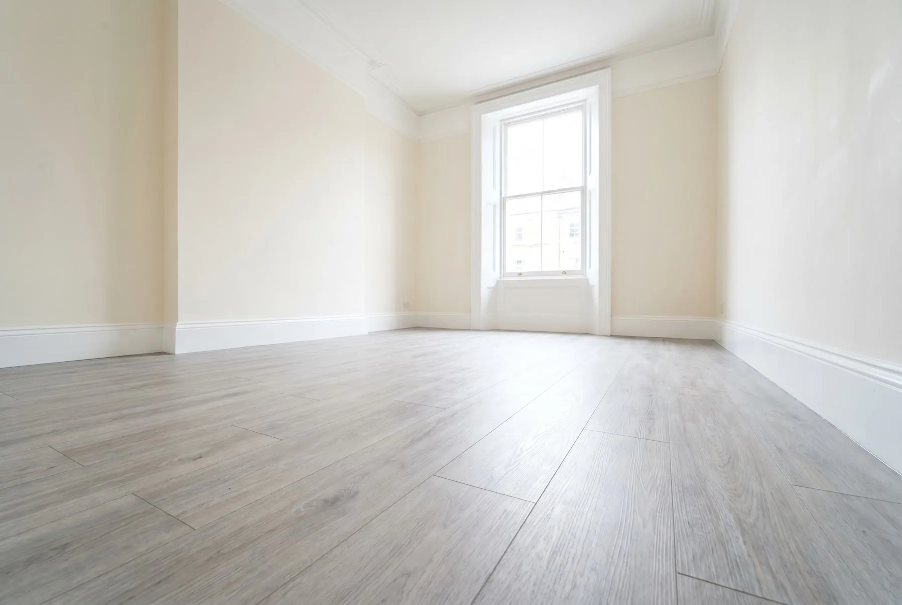 Completed living room renovation with fresh decoration, flooring and lighting in a London property by Ferizi Property Services
